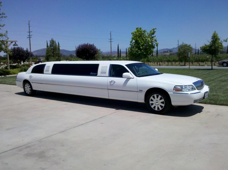 White Stretch Limo Service by Coachman Enterprises Limo Service
